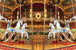 festive merry-go-round carousel with horses and lights in Frankfurt during the Christmas market, Christmas holiday