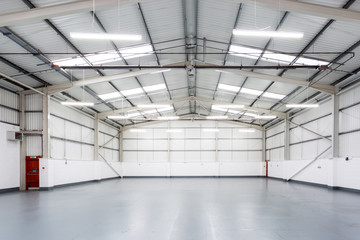 An interior of a large, empty warehouse