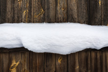 Old Wooden Fence Covered With Clean Snow