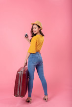 Beautiful Young Woman Travel With Vintage Suitcase And Camera On Pink Background. Vertical Image.