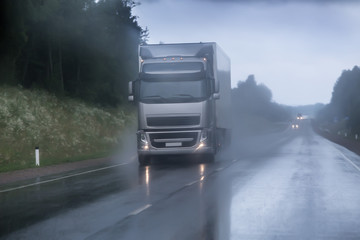 Wall Mural - truck moving in rain and fog