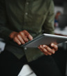 © StratfordProductions - Close-up of a businessman folding and touching the digital tablet
