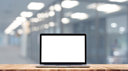 Wall Mural - Modern computer,laptop with blank screen on counter bar(retail store shop)and glass wall office