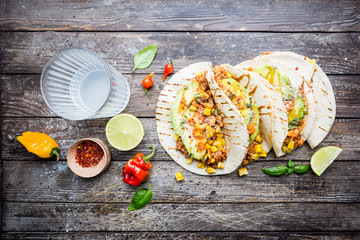 Wall Mural - Mexican tacos with meat, beans corn and salsa. Top view