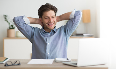 Wall Mural - Successful Entrepreneur Relaxing Sitting At Laptop At Workplace