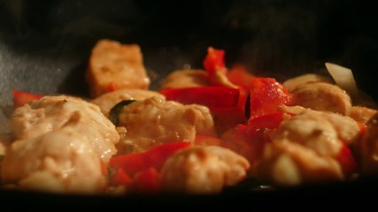 Wall Mural - Fry thai chicken with bell paper on wok pan. Cooking tasty meal