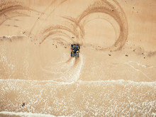 Extreme Sport On Quad Bike Beach Of Sea Leaves Traces. Aerial Top View