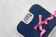 © Pixel-Shot - Scales and measuring tape on light background. Weight loss concept
