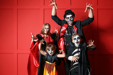 Sticker - Family in Halloween costumes on color background