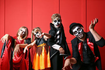 Sticker - Family in Halloween costumes on color background