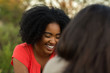 © digitalskillet1 - Diverse group of friends talking and laughing.