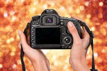 Sticker - Hands holding modern camera isolated on white background