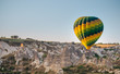 a brightly colored hot air balloon over cappadocia