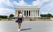 Beautiful girl posing at the Lincoln Memorial in Washington DC, USA