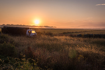 Wall Mural - Old truck on a farm field at sunrise, Pine Island, NY, early fall