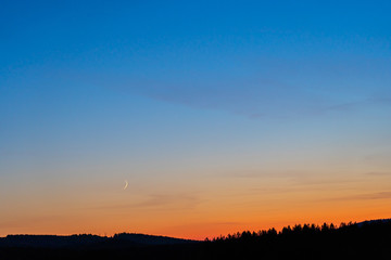 Colorful clear sky with no clouds at dusk after sunset.