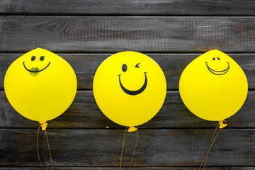 Wall Mural - Happiness emotion. Yellow balloon with smile on blue background top view