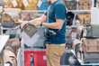 Male photographer choose camera bag that is suitable for the size of the camera used in photoghaphic store.