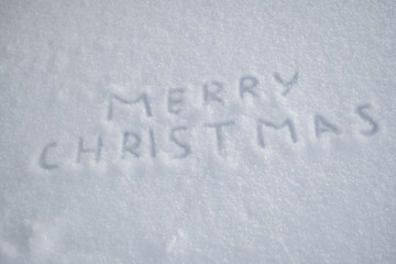 text merry christmas on snow