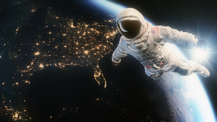 Wall Mural - Astronaut in Orbit above Planet Earth and USA