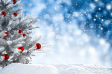 chrismtas background of snow and free space for your decoration. blurred space and xmas tree