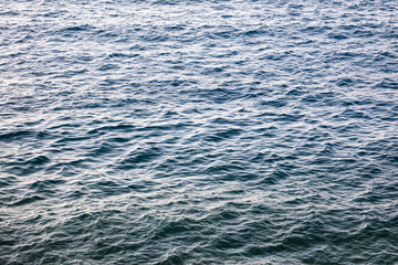 Blue expanse of water at sea as abstract background