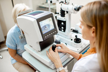 Ophthalmologist Examining Eyes Of A Senior Patient Using Digital Microscope During A Medical Examination In The Ophthalmologic Office
