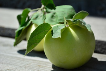 Green apples on a wooden backround