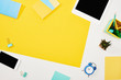 © LIGHTFIELD STUDIOS - top view of digital tablet, smartphone with blank screen and office supplies on yellow and white background