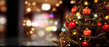 Chrismtas Background Of Xmas Tree And Blurred Home Interior. Free Space For Your Decoration On Desk 