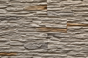 Close-up of white decorative faux stone wall