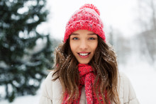 People, Season And Christmas Concept - Portrait Of Happy Smiling Teenage Girl Or Young Woman Outdoors In Winter Park