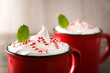 Peppermint coffee mocha for Christmas on wooden table. Close up