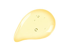 Serum Texture. Face Oil, Liquid Gel Drop Isolated On White Background. Yellow Colored Cosmetic Skincare Product With Bubbles Swatch