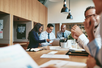 Wall Mural - Smiling group of diverse businesspeople working together in an o