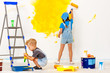 © JenkoAtaman - Repair in apartment. Happy children boy and girl paints wall