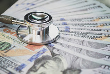 Medical Cost Rising, Stethoscope On Dollar Banknote Money. Concept Of Health Care Costs, Finance, Health Insurance Funds. 