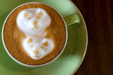 Close-up Of A Cup Of Coffee With Froth Decoration