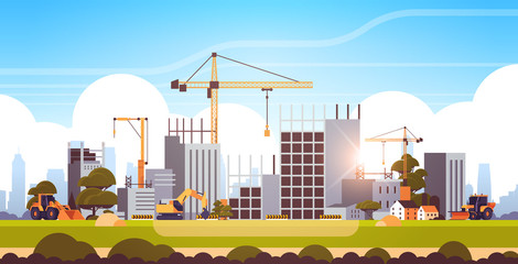 Wall Mural - modern construction site with cranes tractor and bulldozer unfinished building exterior sunset background flat horizontal