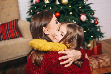 mom daughter indulge fun inside Christmas decorations