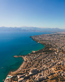 Window view of an airplane on the coast of Antalya with beautiful Taurus Mountains on the horizon, Turkey