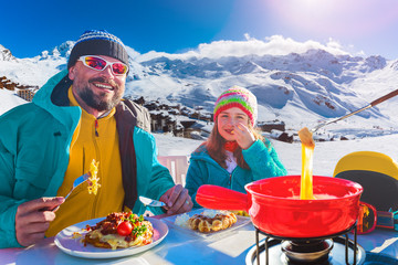 Fototapete - Ski restaurant lunch break with Fondue cheese, mountain view of Val Thorens, 3 valleys , France.
