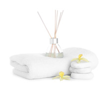 Towel, Air Freshener, Flowers And Spa Stones Isolated On White