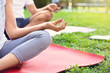 © New Africa - Woman practicing morning yoga in park, closeup. Space for text
