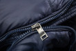 broken zipper lock. damaged zip closeup. fix cloth.