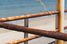 Rusty Fence On The Beach