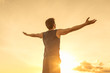 © kieferpix - Success achievement accomplishment and motivation concept with man sunset silhouette celebrating arms up raised outstretched outdoors in nature