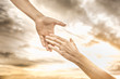 Hand reaching out to help another. Helping a friend in need.