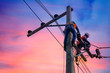 Leinwandbild Motiv Electrician lineman repairman worker at climbing work on electric post power pole
