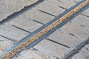 Wall Mural - abstract metal line barrier on stone surface closeup, technology diversity